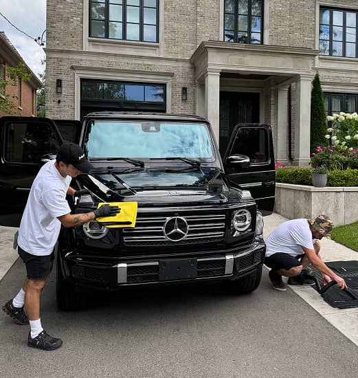 mobile car detailing professionals washing the car exterior and interior 